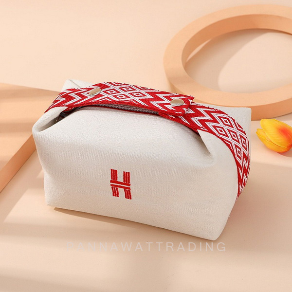 กระเป๋าเครื่องสำอางผ้าแคนวาสสีเบจ ปัก H สายคาดสีแดง